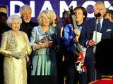 Queen Elizabeth II, Prince Charles and the Duchess of Cornwall on stage outside Buckingham Palace during the Diamond Jubilee Concert.