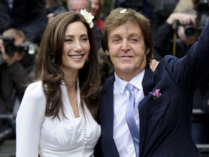 Paul McCartney and American heiress Nancy Shevell greet fans after their wedding at Marylebone Town Hall, London