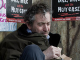 Ashley lies in a shop doorway, feeling devastated he breaks down