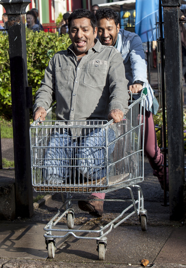 Masood rolls down the pavement in the trolley.
