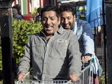 Masood rolls down the pavement in the trolley.