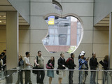 Customers rush into the Apple Store in downtown Chicago Friday, June 29, 2007, to purchase the company's new iPhone