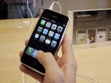 Apple customers look at the new Apple iPhone at an Apple store in Palo Alto, Calif., Tuesday, July 24, 2007