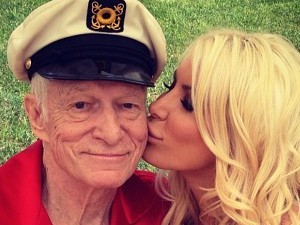 Hugh Hefner and Crystal Harris kiss on Independence Day