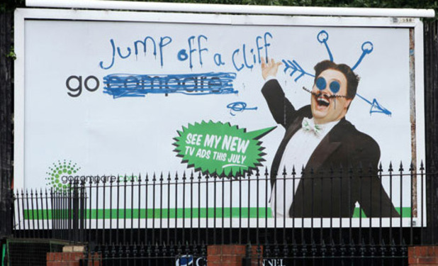 A defaced 'Go Compare' billboard advert