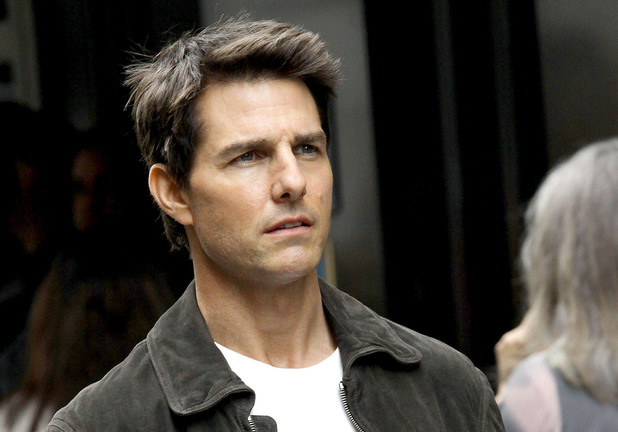 Tom Cruise filming on the set of 'Oblivion' at the foot of the Empire State Building New York