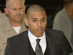 Chris Brown, center, and attorney Mark Geragos, right, arrive for Brown's sentencing for assaulting his girlfriend Rihanna, at Los Angeles County Superior Court in Los Angeles, Tuesday, Aug. 25, 2009