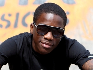 Tinchy Stryder rides a BMX bike