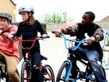Tinchy Stryder rides a BMX bike