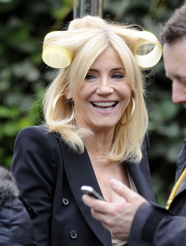 Michelle Collins on set with hair rollers