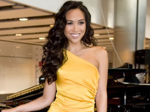 Singer and TV presenter Myleene Klass performs 'Chariots of Fire' to incoming passangers at Terminal 5, Heathrow Airport