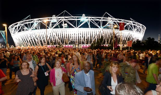 London 2012: Crowds leave the Olympic Stadium following a technical rehearsal for the opening ceremony