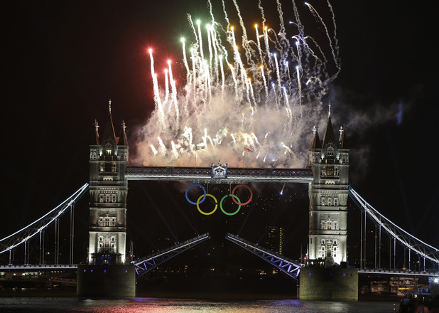 Fireworks explode above the iconic Tower Bridge over the River Thames during the Opening Ceremony. 