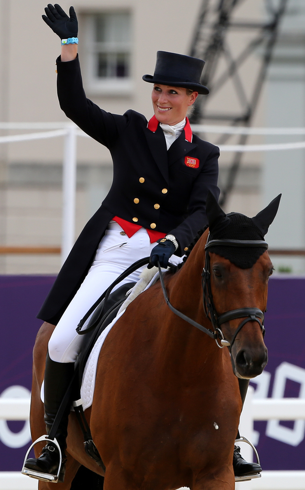 Zara Phillips waves on High Kingdom after the Dressage stage of the Eventing at Greenwich Park.