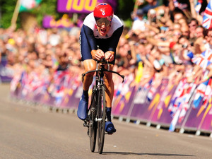 Great Britain's Bradley Wiggins races towards the finish line during the Men's Individual Time Trial on day five of the London Olympic Games at Hampton Court Palace