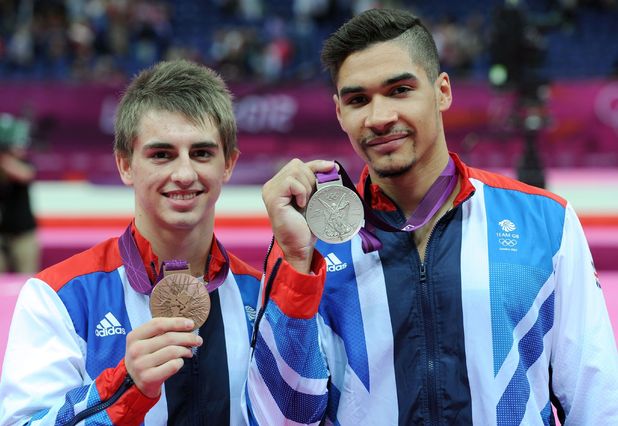 Max Whitlock and Louis Smith celebrate with their medals after the Men's Pommel Horse Final.