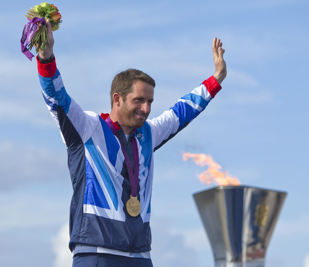 Ben Ainslie celebrates winning his fourth Olympic gold medal.