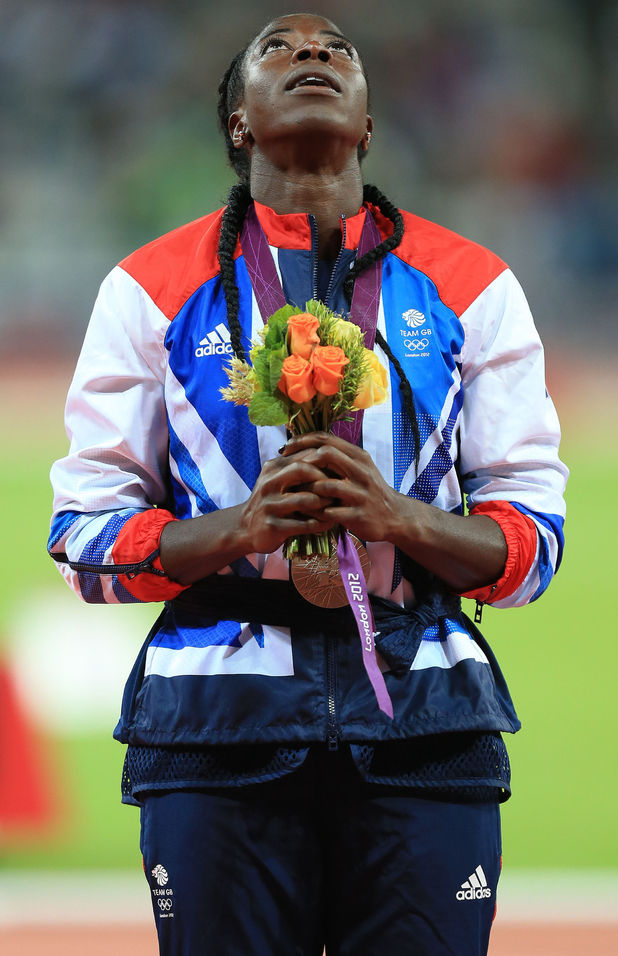 An emotional Christine Ohuruogu receives her silver medal after the 400m final at the Olympic Stadium, London.