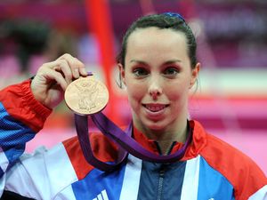 Beth Tweddle celebrates with her Bronze medal after the Women's Uneven Bars Final