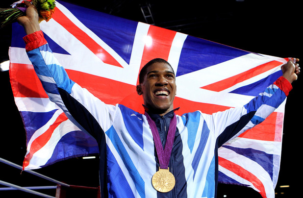 Anthony Joshua celebrates with his Gold medal following his Super Heavy Weight Final against Italy's Roberto Cammarelle.