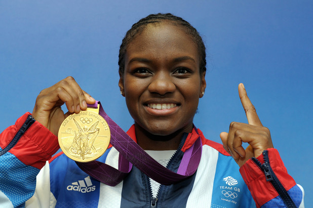 Nicola Adams poses with her gold medal won in the 51kg women's boxing competition (August 9).