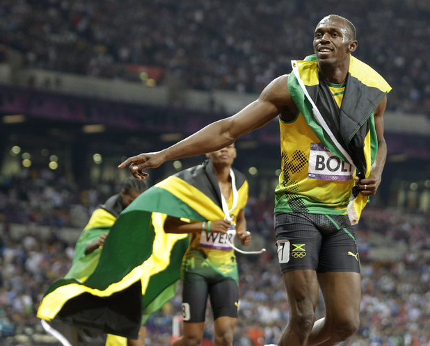 Usain Bolt celebrates men's 200m victory