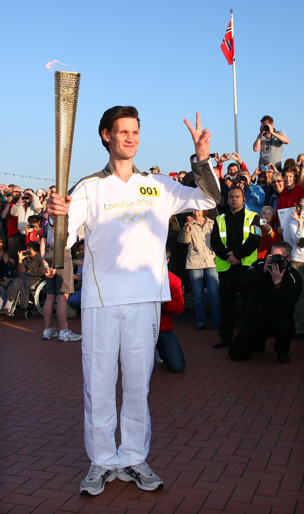 Matt Smith, carrying the Olympic Flame on the Torch Relay leg through Cardiff.