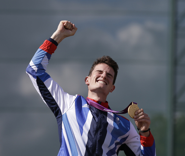 Great Britain's Peter Wilson reacts after receiving the gold medal for men's double trap event