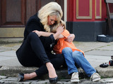 Sharon cradles Denny in the spot where his Dad died.
