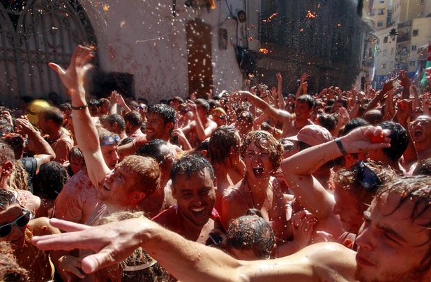 Revellers throw tomatoes at the annual La Tomatina festival in Bunol, Valencia, Spain (August 29, 2012)