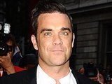 Robbie Williams arriving at the 2012 GQ Men Of The Year Awards at the Royal Opera House, London