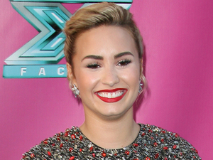 Demi Lovato at The X Factor USA Season 2 premiere screening and handprint ceremony at Grauman's Chinese Theater, Los Angeles