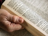 Stock image of a person using a dictionary