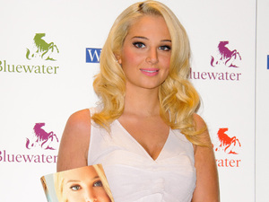 Tulisa Contostavlos signs copies of her autobiography 'Honest - My story so far' at WHSmith's, Bluewater shopping centre Kent, England - 26.09.12