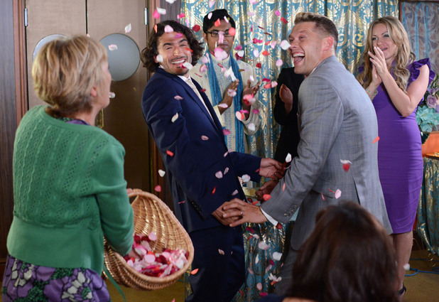 Jean throws confetti over the happy couple.