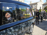 6385: The hearse of Carl makes it's way through the village