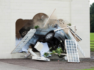 The Minibus crashes through the Orangery.