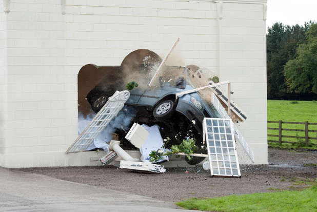 The Minibus crashes through the Orangery.
