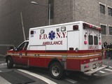 In this Wednesday, Oct. 31, 2012 file photo, an ambulance departs Bellevue Hospital in New York where patients were being evacuated.