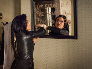 Kat erases the message from her lover.