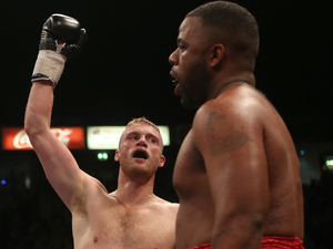 Andrew Flintoff celebrates his victory over Richard Dawson (right) during the International Heavyweight Contest at the Manchester Arena, Manchester.