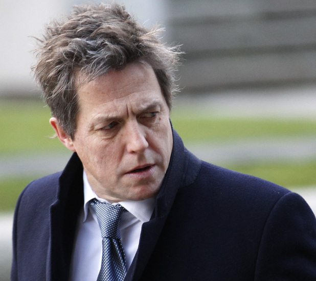 British actor Hugh Grant, who testified to the Leveson Inquiry, arrives at the Queen Elizabeth II Conference Centre in London where Lord Justice Brian Leveson is to release his report