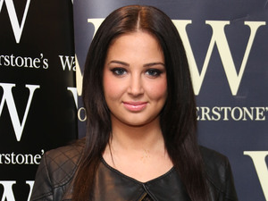 Tulisa Contostavlos signs copies of her book 'Honest' at Waterstones.