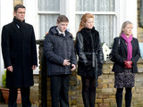 Derek's coffin passes through Albert Square on the way to the funeral.