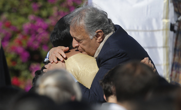Sukanya Rajan, left, is comforted by conductor Zubin Mehta during a memorial service for Ravi Shankar