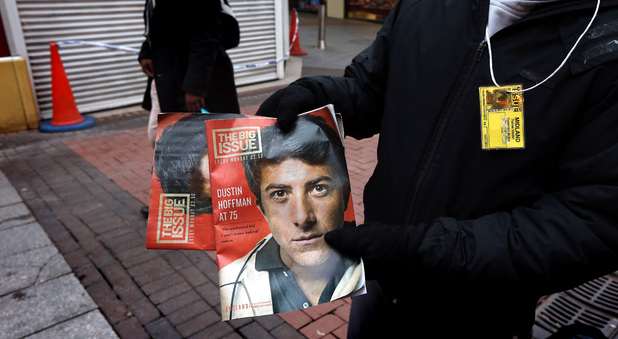 A Big Issue seller outside Sainsbury's on Union St., Birmingham