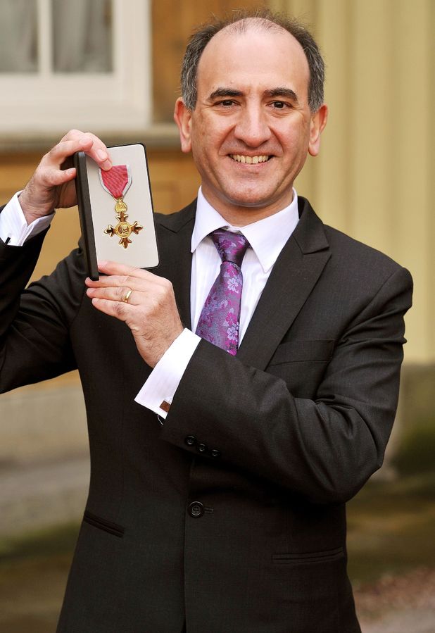 The Prince of Wales presents Armando Iannucci with his Officer of the British Empire (OBE) medal during an Investiture Ceremony at Buckingham Palace in central London.