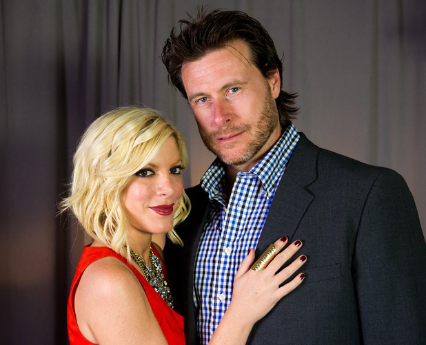 Tori Spelling and Dean McDermott pose for a portrait in New York, Monday, April 4, 2011.