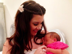 Imogen Thomas cradles daughter Ariana Siena in a Twitter picture from 4 March 2013