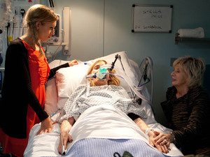 Eva and Gloria at Stella's bedside after the Rovers fire